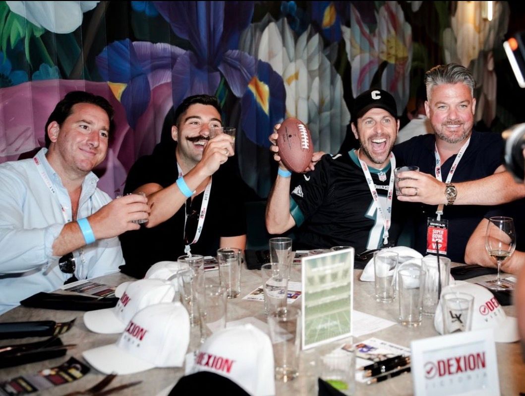Guests celebrating at a 4QTR Super Bowl party