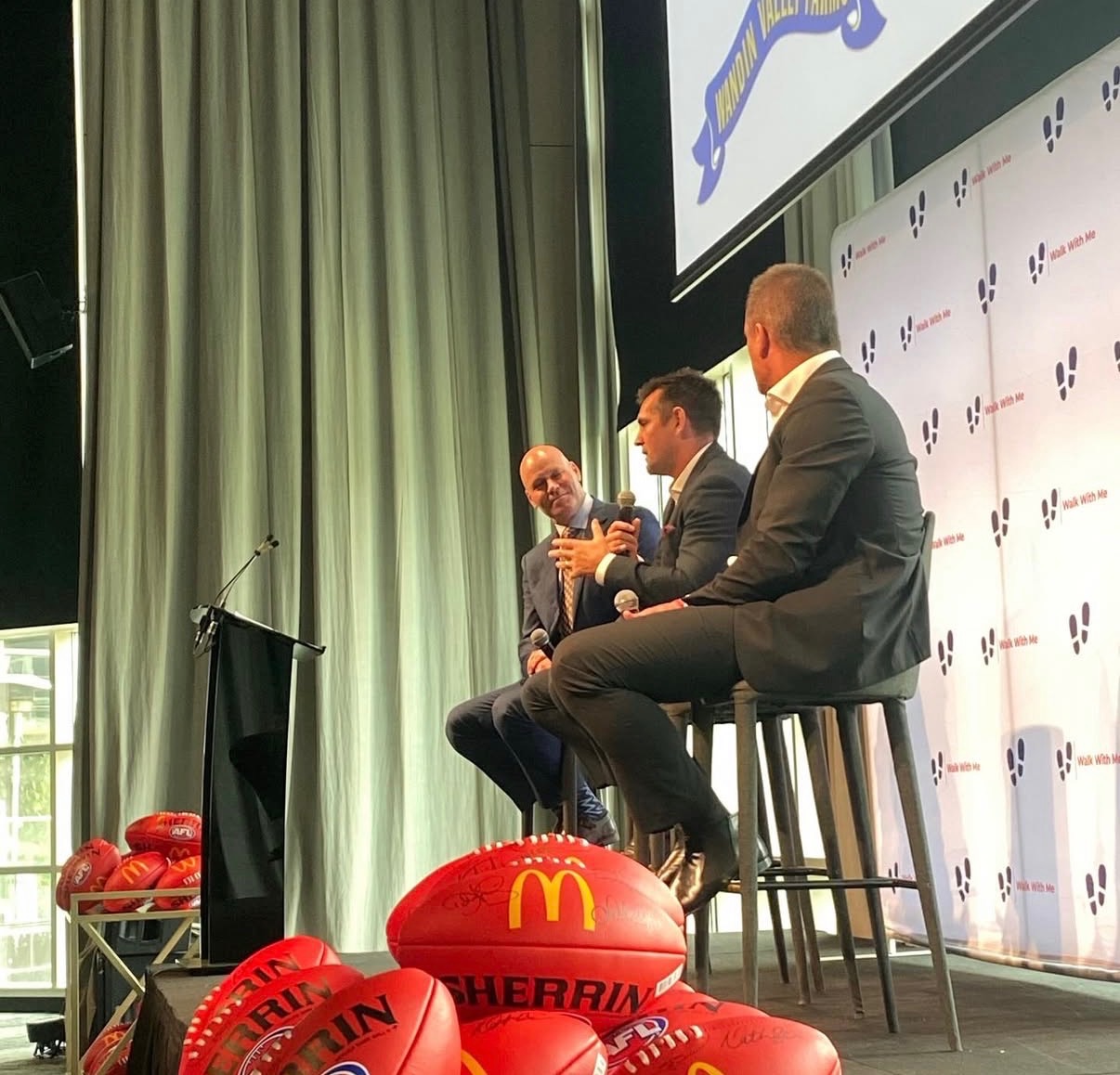 On-stage panel with speakers at a 4QTR event