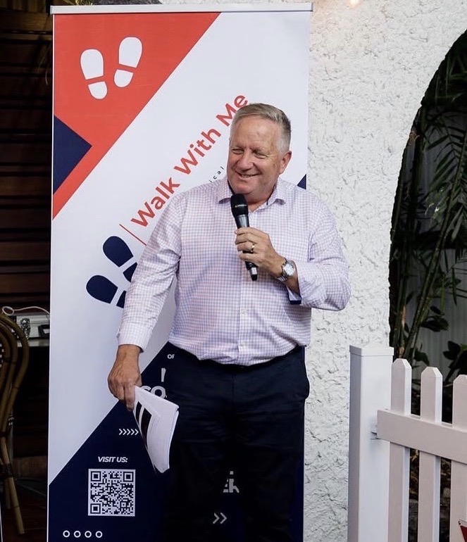Host speaking at a Walk With Me lunch