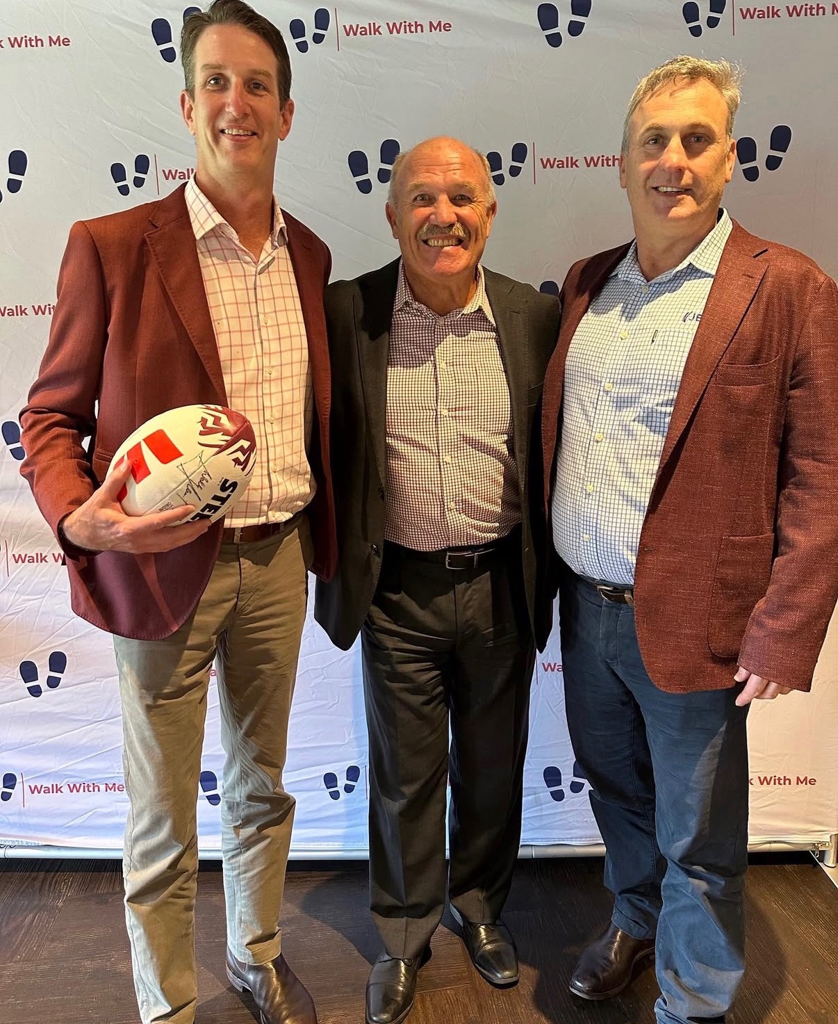 Guests with a signed rugby league ball