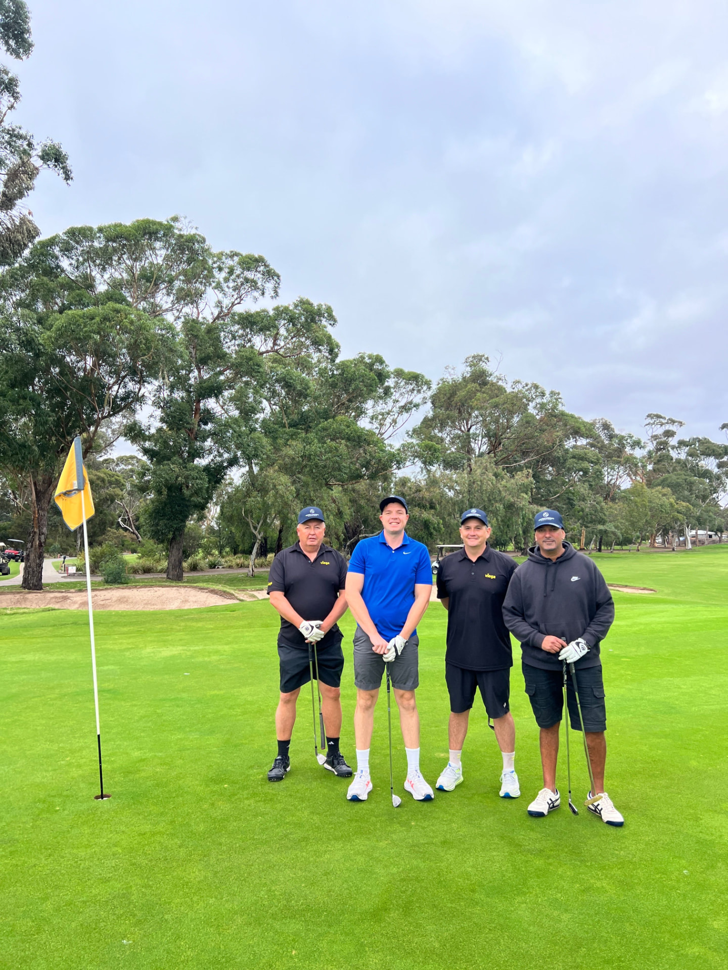 Players on the green at a 4QTR corporate golf day