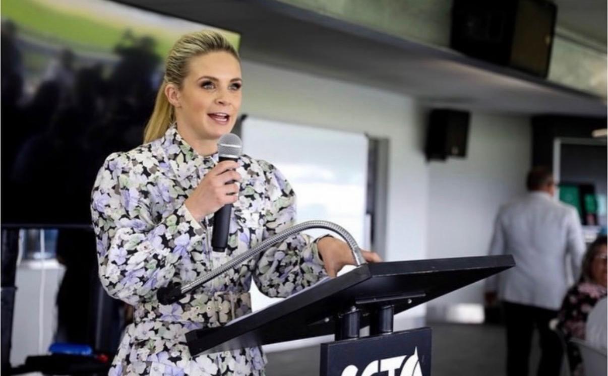 Co-host speaking at a 4QTR corporate race day